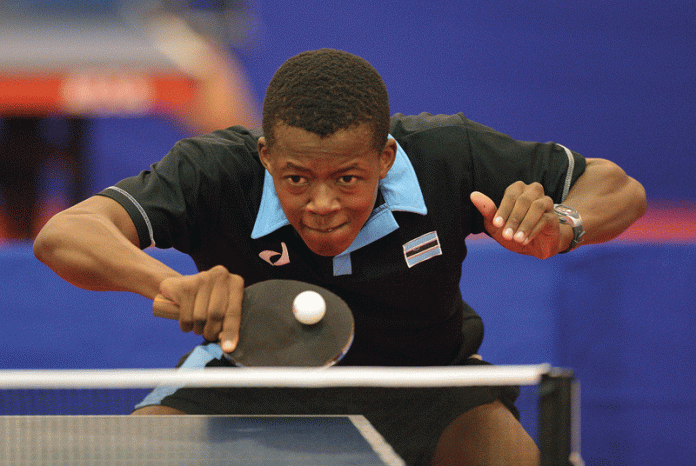 resilience in table tennis. table tennis player at match point handling pressure under competition lighting